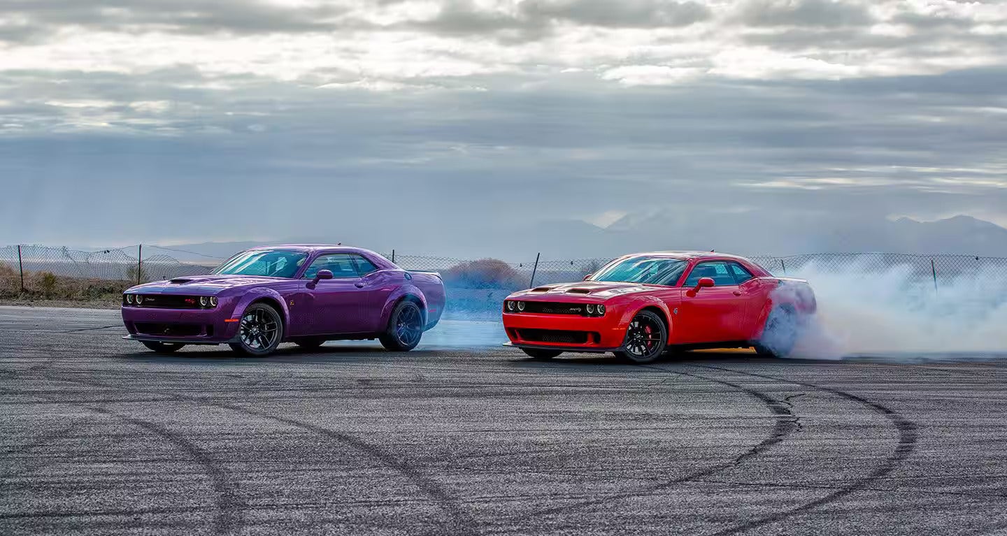Dodge Two Challenger doing a smoky burnout on the track