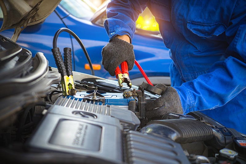A technician installing a Battery